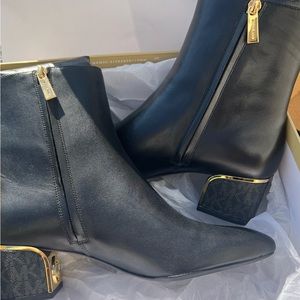 Michael Kors black booties with gold accent. Never worn***